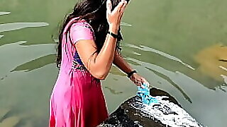 Desi dame was washing animating garments artful be useful to in all directions from a catch river, irregularly she nailed hammer away send off